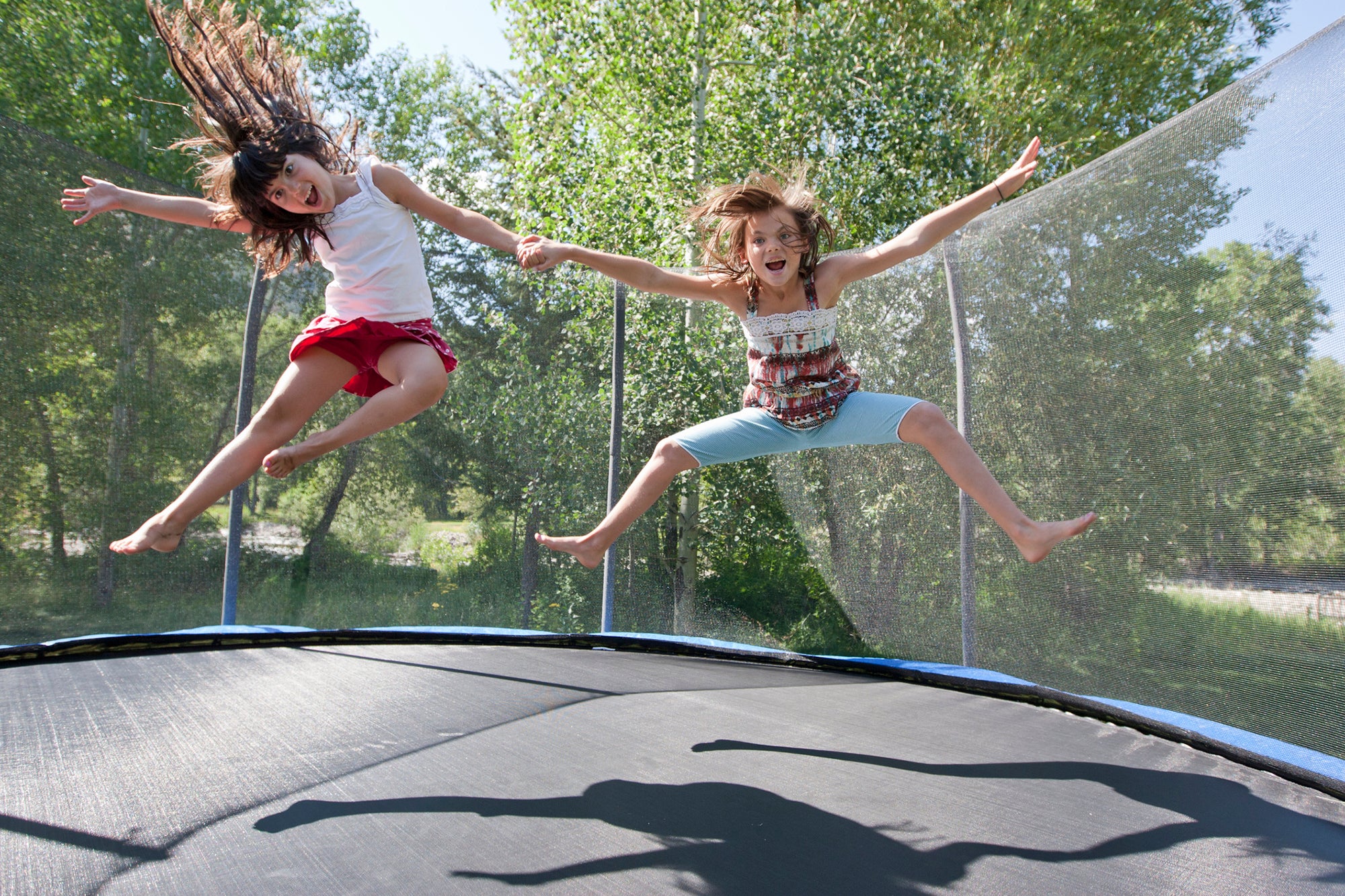 Sisters jumping on a trampoline