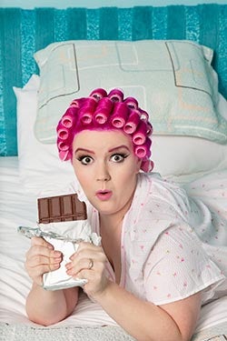 lady in rollers eating chocolate