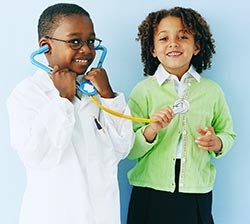 two children playing doctor and patient