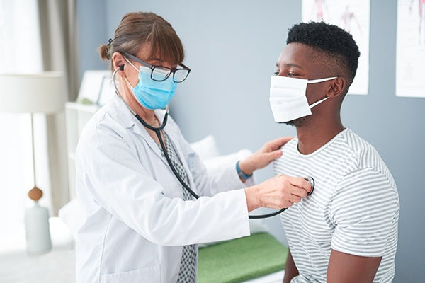 Doctor checking on patient