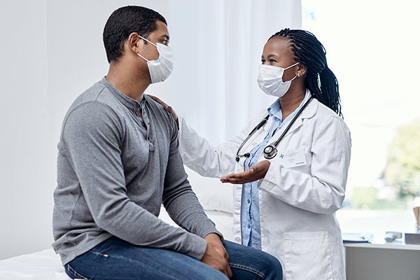 Doctor speaking with patient