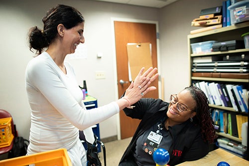 Neha Zadoo giving high five