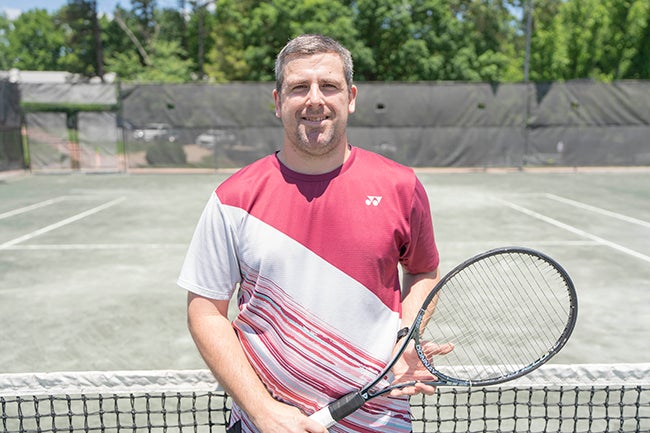Bryan Posing with Tennis Raquet