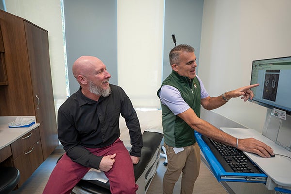 Jason and Dr. Chawla showing him imaging
