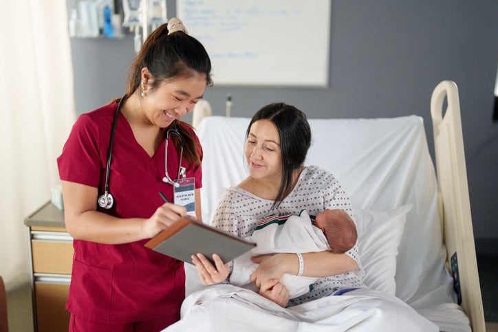 health care worker in red scrubs