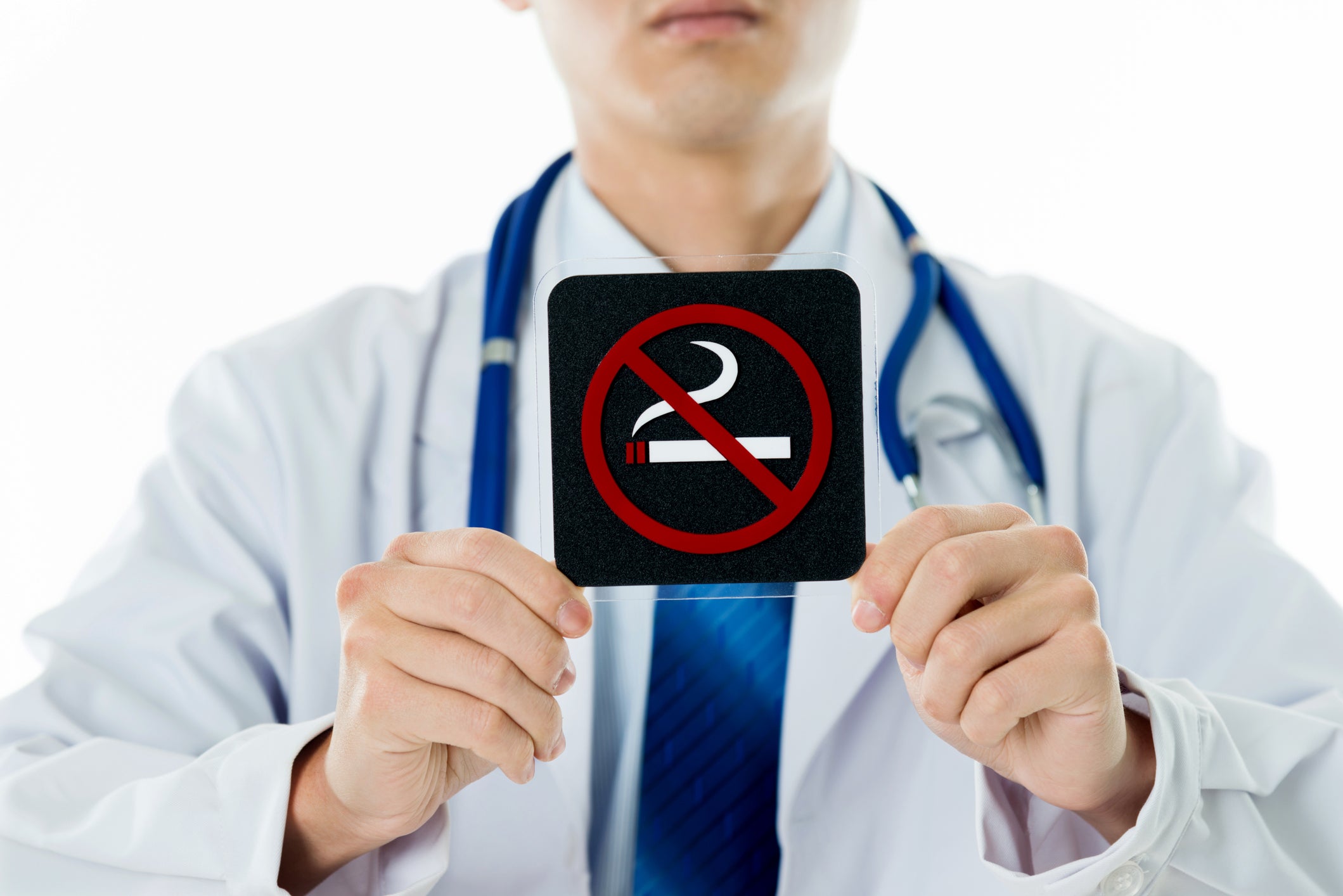 Doctor holding No Smoking sign