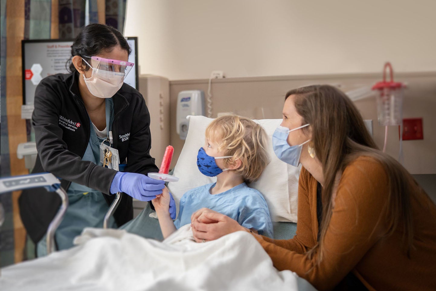 pediatric patient with nurse and mom