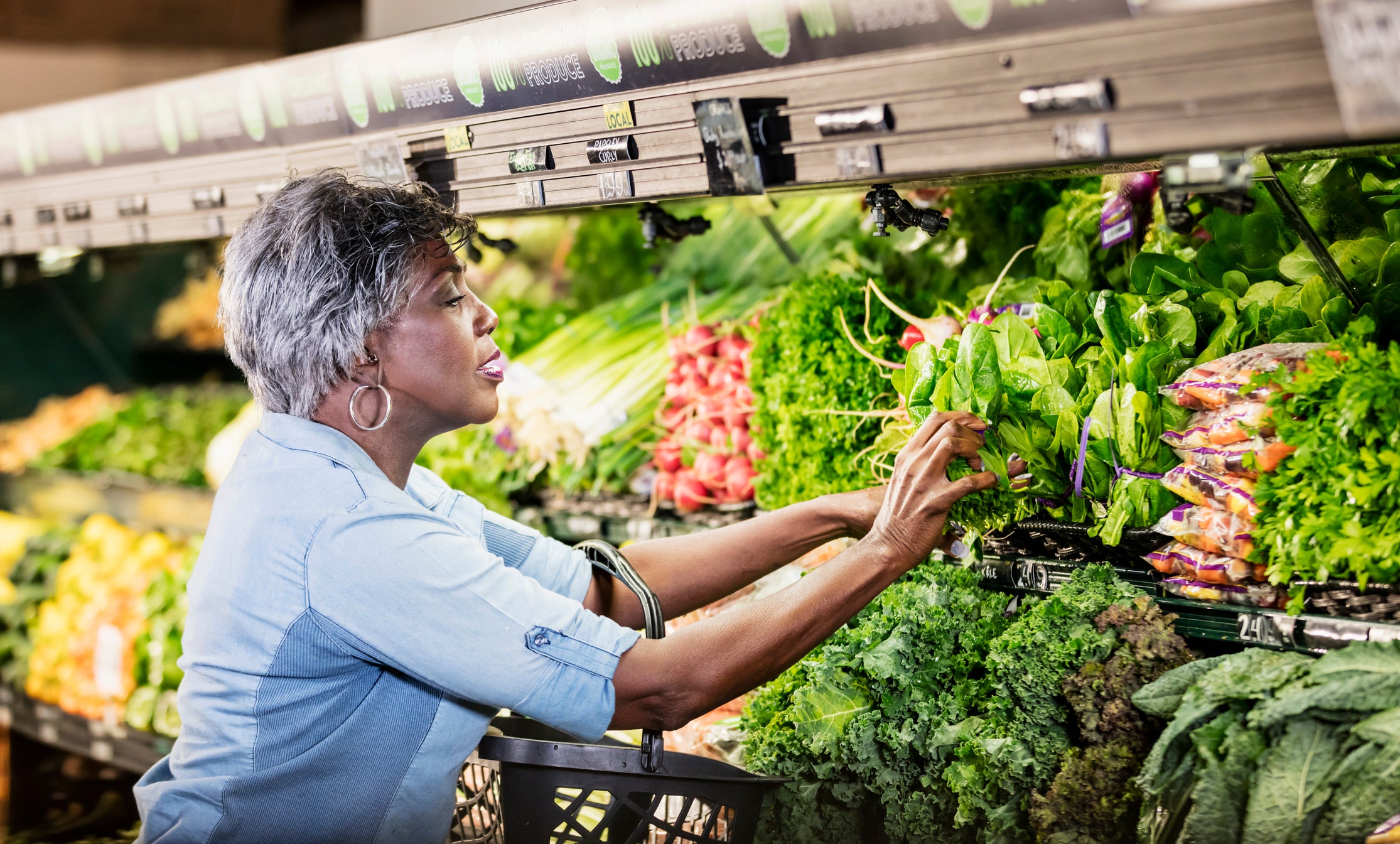 Senior African American woman shopping in supermarket
