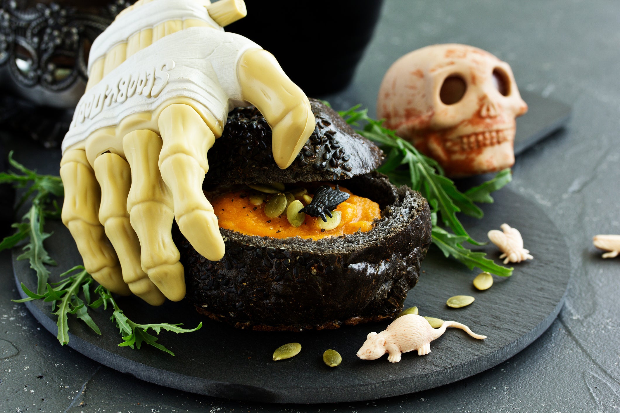 pumpkin soup in a black bun for the holiday of Halloween.