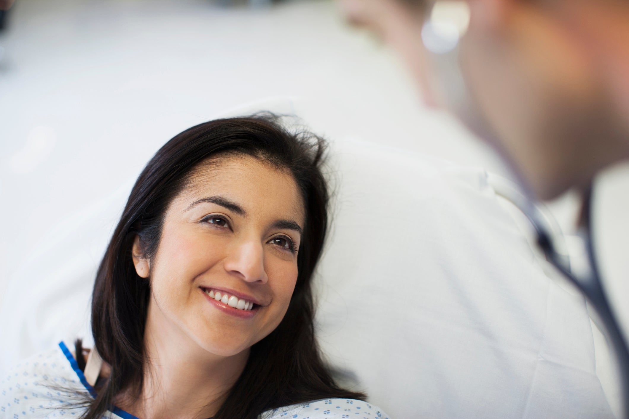 Patient smiling at doctor in hospital