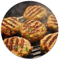 turkey burger patties with grill marks in a cast iron grill pan