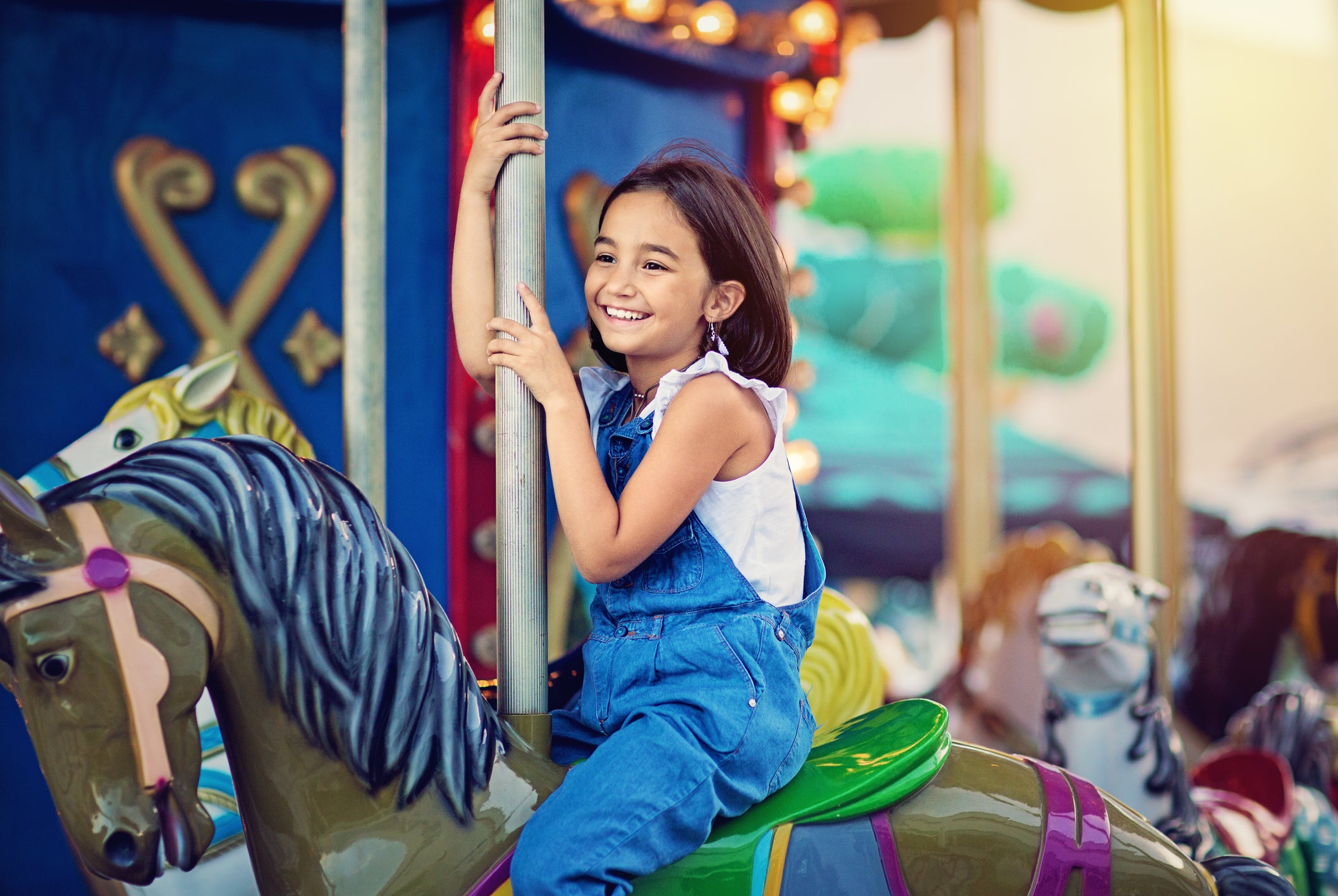 Little girl on carousel