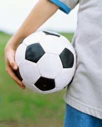 boy holding soccer ball