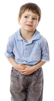 little boy holding stomach