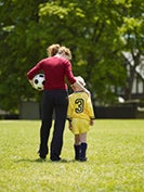 mom and son on soccer field