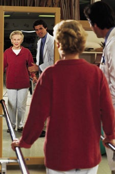 older woman walking with support