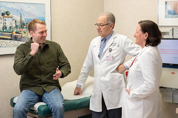 Ben talking with doctors