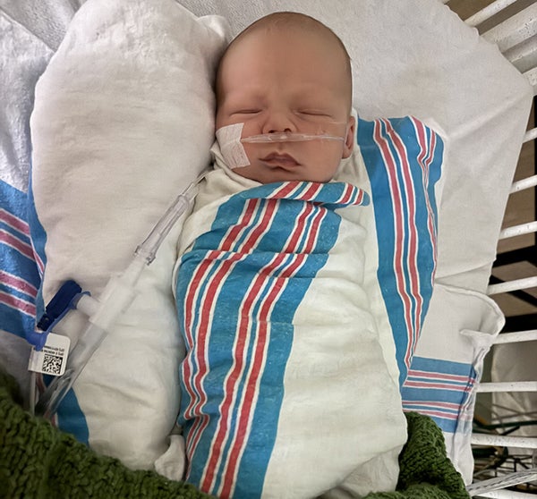baby in hospital with obvious oxygen tube