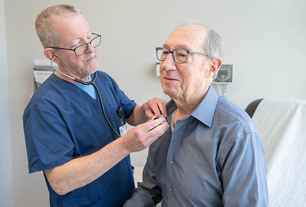 Dr. Whelan checking patient