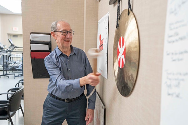 Bob graduating rehab by hitting gong