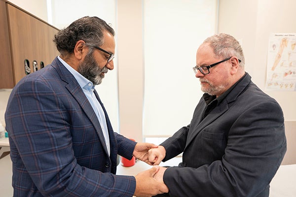 Dr. checking range of motion