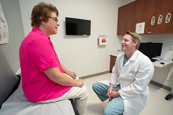 Nancy smiling with Dr. Kauk
