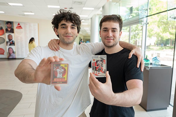 brothers with sports cards