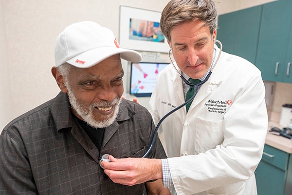 Dr. Upham doing heart check