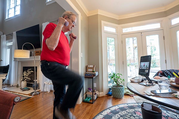 George lifting weights