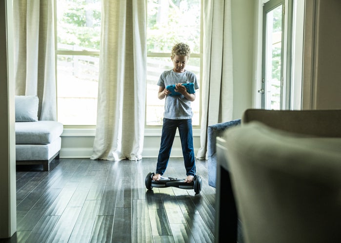 child riding hoverboard