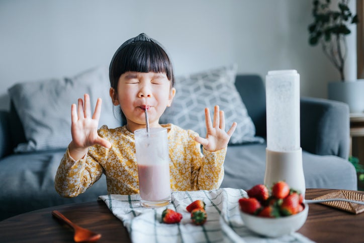 child drinking smoothie
