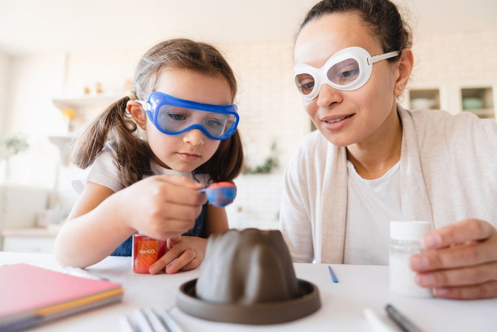 child playing with chemistry kit