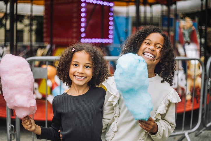 sisters eating cotton candy