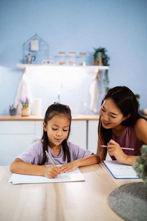 mom and daughter doing homework