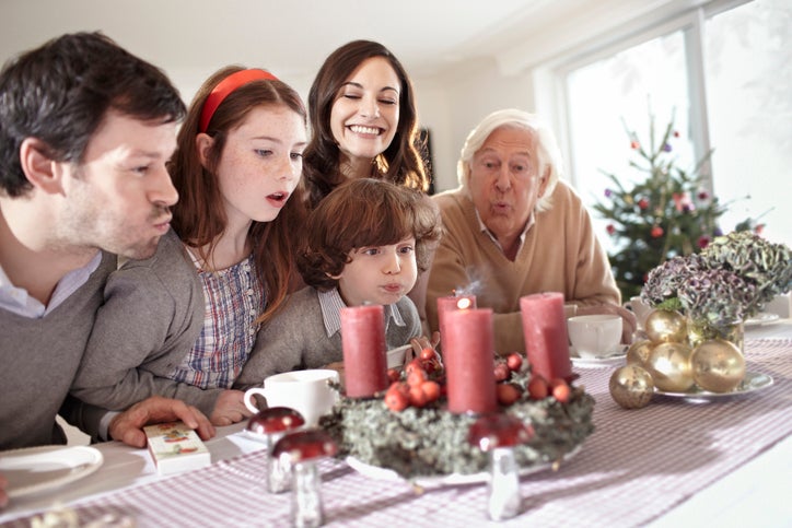 blowing out holiday candles