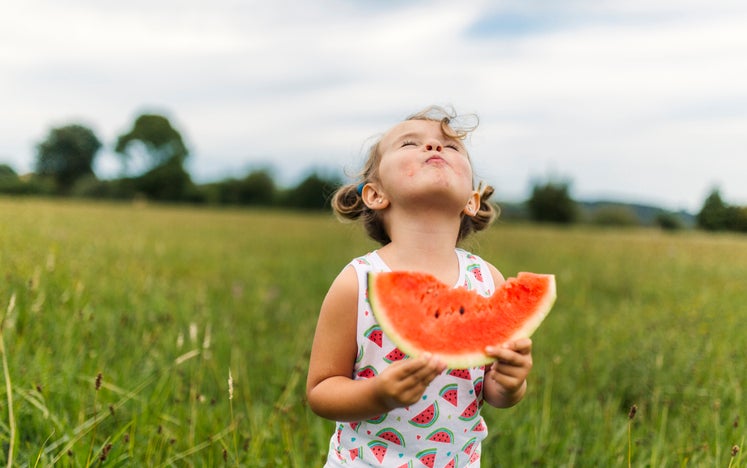 child eating watermelon