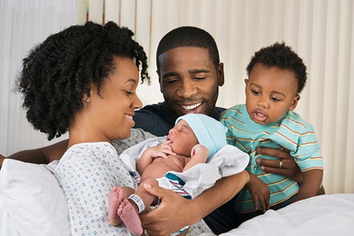 woman and family after labor and delivery