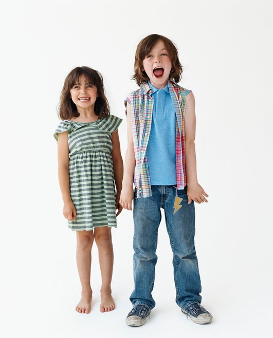 two children side by side different heights