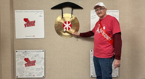 Jim ringing the bell at Cardiac Rehab