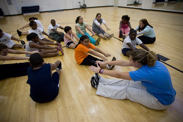Children stretching in group