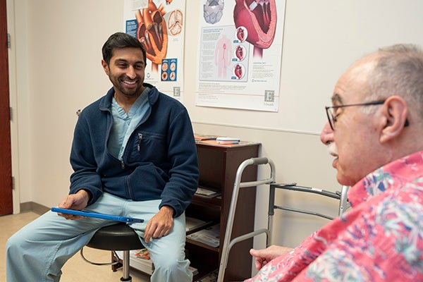 Dr. Patel chatting with Lee