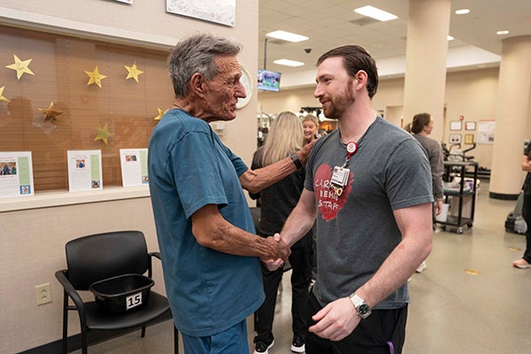 Billy shaking hands