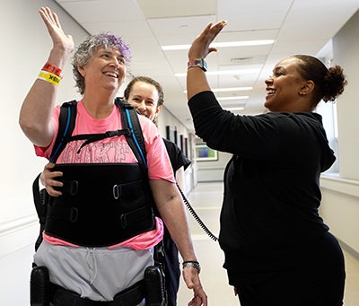 woman with walking robot