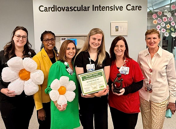 Whitney and team with Daisy Award