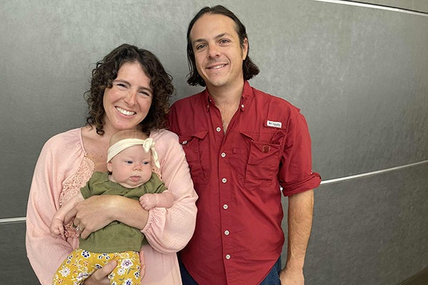 Cameron and her husband and baby