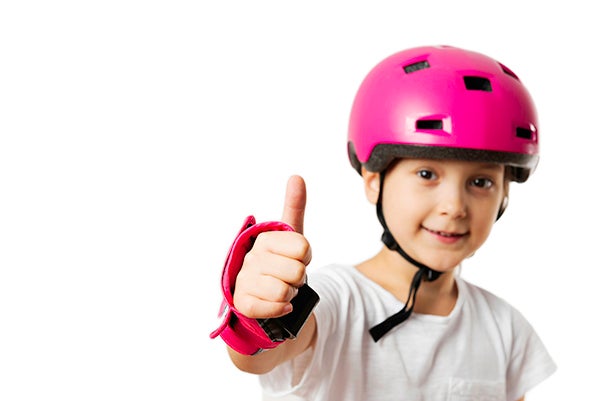girl in helmet giving thumbs up