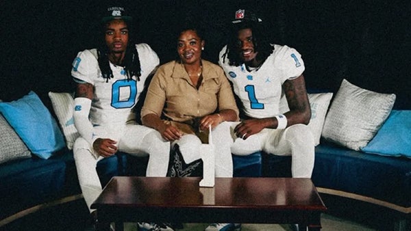 Latara sitting proudly with her sons