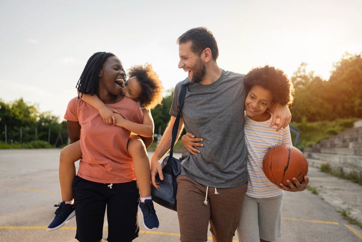 family playing basketball